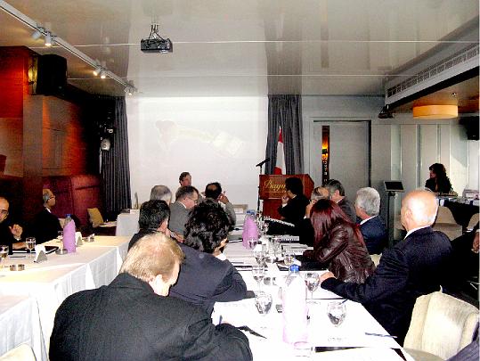 37 digital divide.jpg - Presentation and conference call at a luncheon concerning the increase of technology in the Arab world. The audience was fascinated by principles of of developing the Unified Field of whole brain functioning.
